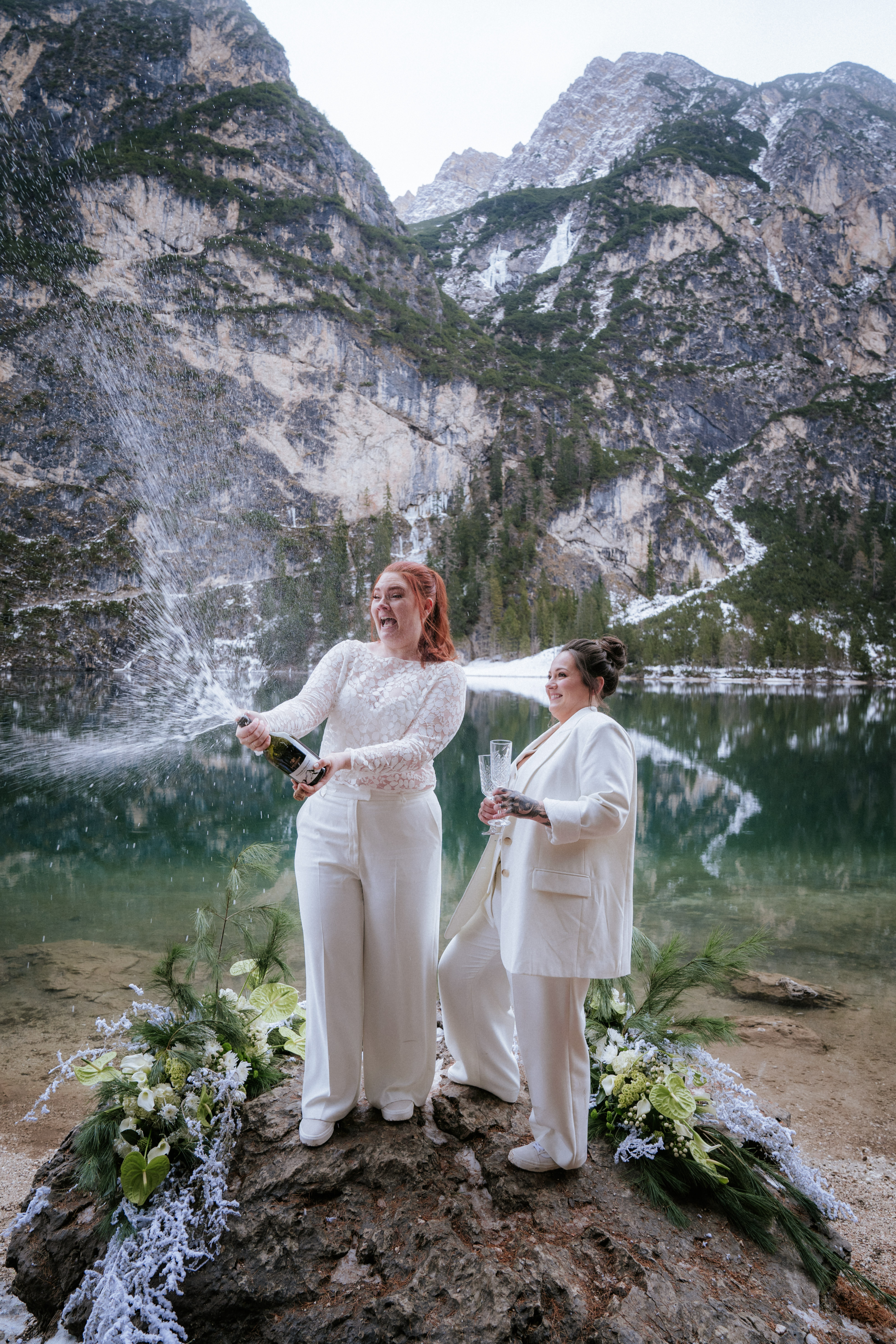 Intimate moment between bride and groom during their elopement at Lago di Braies – quiet and still morning