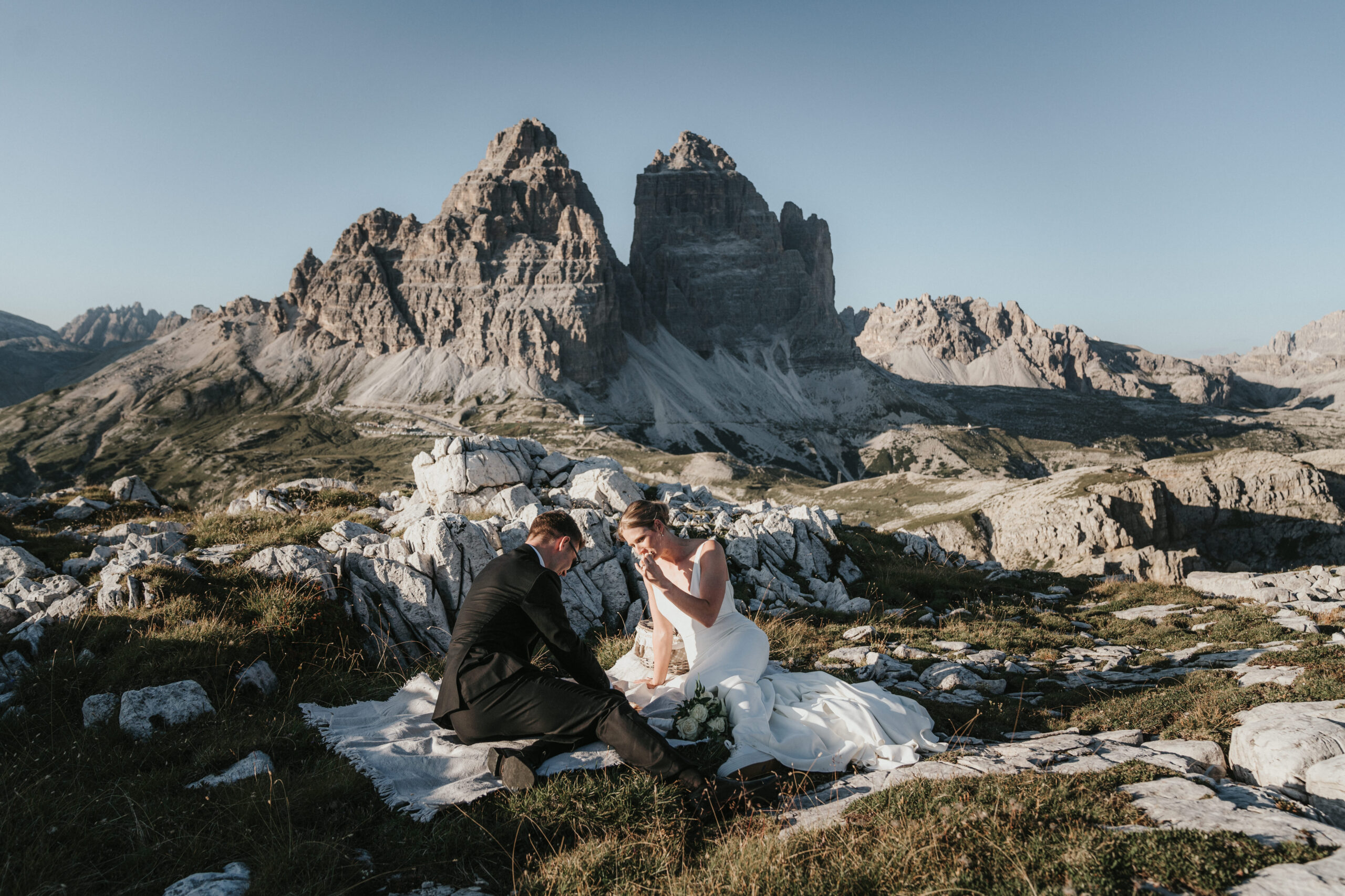 The iconic Tre Cime di Lavaredo towering over the Dolomites, an unforgettable sight for any elopement or adventure.